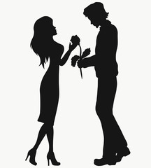 Young handsome man giving a rose to a beautiful girl, silhouette