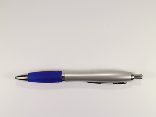 ballpoint pen in blue color on a white background