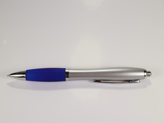 ballpoint pen in blue color on a white background