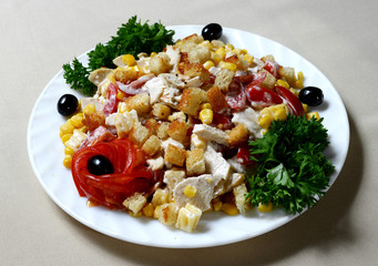 Fresh vegetable salad with chicken meat on plate.