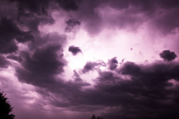 Lightning behind clouds