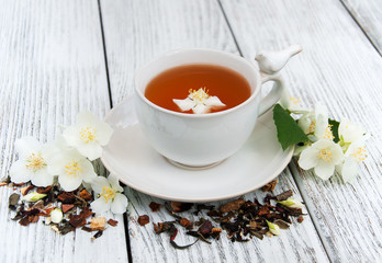 Cup of tea with jasmine flowers
