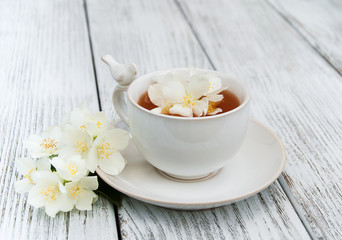 Cup of tea with jasmine flowers