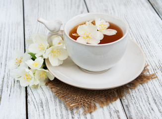 Cup of tea with jasmine flowers