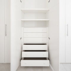 Open wardrobe, detail of the cabinet drawers