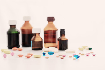 Composition of medicine bottles and pills  on white background