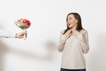 Delight woman, man hand aside with bouquet of beautiful roses flowers isolated on white background. Copy space for advertisement. St. Valentine's Day, International Women Day birthday holiday concept.