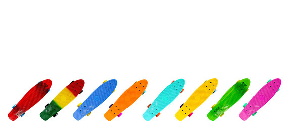 Collection of colorful skateboards isolated on white background with copy space, horizontal image