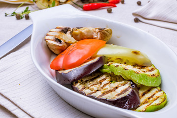 Grilled vegetables on a white plate