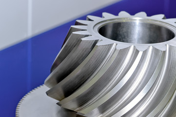 Industrial conical gear with spiral machine teeth.