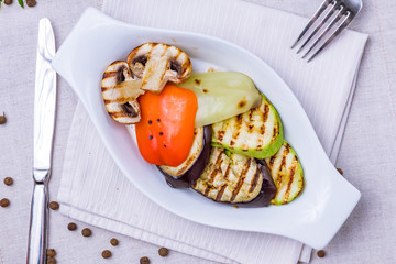 Grilled vegetables on a white plate