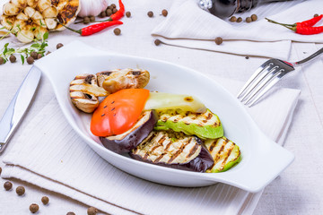 Grilled vegetables on a white plate