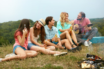 Happy Friends Having Fun On Picnic In Nature