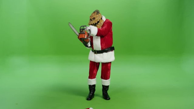 Horror Santa Claus shows his chainsaw
