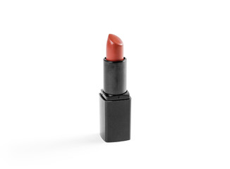 Lipstick in black case on white background. Closeup