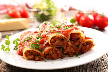 canneloni with beef and tomato sauce