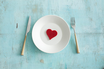 Dish with cutlery for Valentine's day