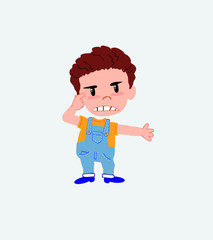 White boy in jeans, is angry and points his head with his index finger.