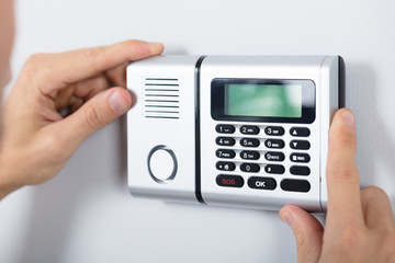 Repairman Installing Security System