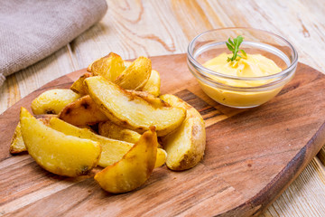 fried potato wedges with cheese sauce
