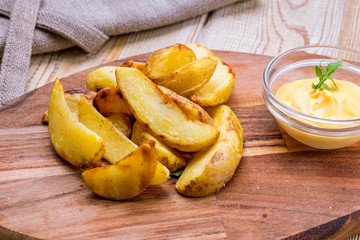 fried potato wedges with cheese sauce