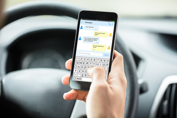 Person's Hand With Mobilephone Text Messaging