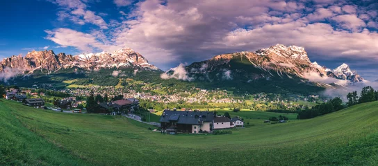 Abwaschbare Fototapete Cortina d'Ampezzo town panoramic view with alpine green landscape and massive Dolomites Alps in the background. Province of Belluno, South Tyrol, Italy. © daliu