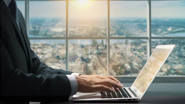 View of Koln Cologne Germany.Close up hand Businessman using laptop
