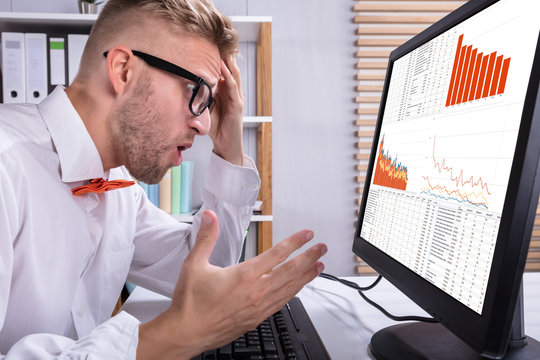 Businessman Looking At Graph