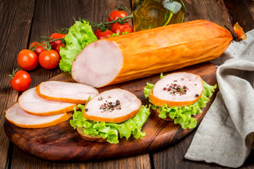 Sausage cut on a wooden board