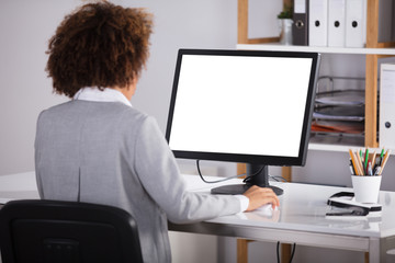 Businesswoman Looking At Blank Computer Screen
