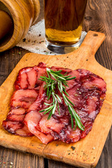 Smoked meat cut into pieces on the background