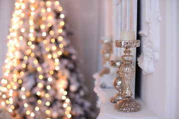 Christmas interior of a living room with a candlestick