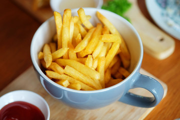 fried potatoes on the wood plate