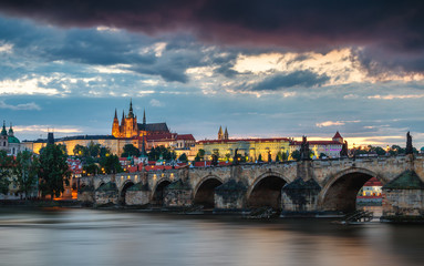 Charles Bridge (Karluv Most) and Lesser Town Tower, Prague in summer at sunset, Czech Republic