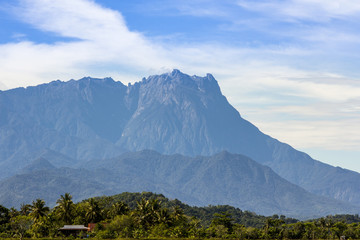 Mount Kinabalu viewed by mid-day from the paddy fields of Sangkir Village, Kota Belud, Sabah.