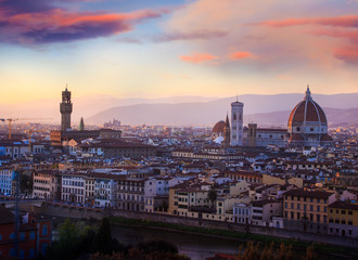 Fototapeta na wymiar Panoramic view of Florence city during golden sunset which Florence from Michelangelo Square in the evening light in spring, a pilgrimage of tourists and romantics at Duomo Cathedral. Italy, Tuscany