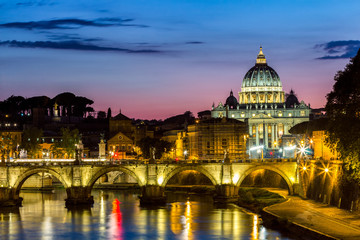 Naklejka na ściany i meble Vatican City, Rome, Italy, Beautiful Vibrant Night image Panorama of St. Peter's Basilica, Ponte St. Angelo and Tiber River at Dusk in Summer. Reflection of The Papal Basilica of St. Peter