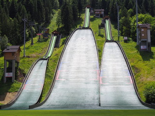 Three ski jump launching pads in town of Szczyrk in Poland - obrazy, fototapety, plakaty