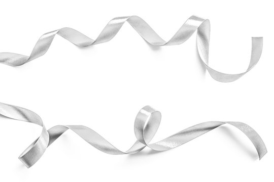 Silver ribbon bow in bright silver white grey color isolated on white background with clipping path for holiday and party greeting card design decoration element