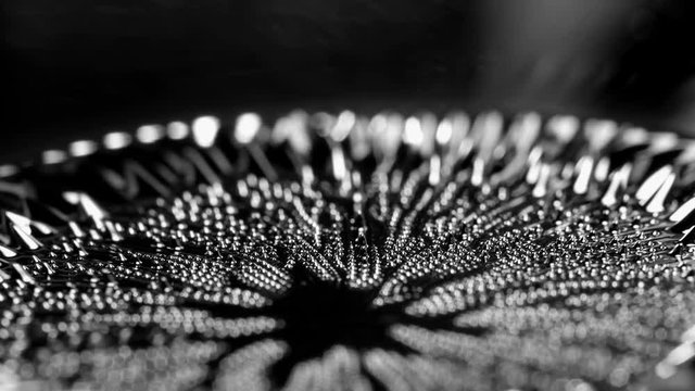 Ferrofluid under the influence of a magnetic field. Abstract background.