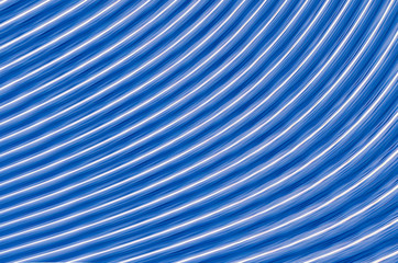 Obraz premium symmetrical glowing lines blue with white stripes effect of movement part of the circle