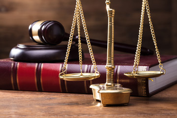Judge Golden Scale In Front Of Gavel And Law Book