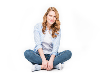 smiling blond woman looking at camera isolated on white