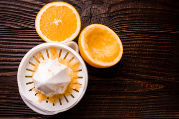 oranges and juice on a wooden background