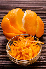 oranges and juice on a wooden background