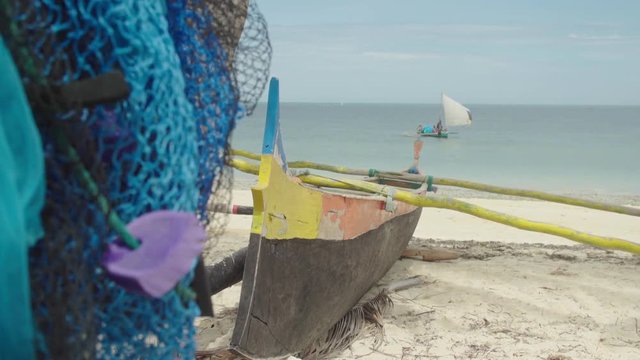 Fishermen arriving in pirogue on Madagascan beach