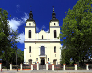 Fototapeta na wymiar Jedwabne, Masuria / Poland - 2009/05/05: historic roman-catholic parish church of St. Jacob Apostel in town of Jedwabne