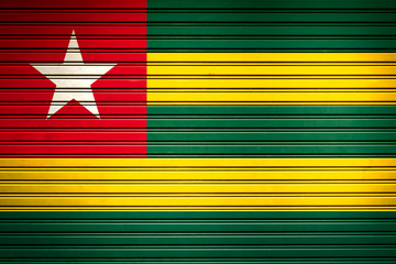 Togo West Africa Flag sign in iron garage door texture, flag background