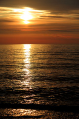 Colorful sunset over the Baltic Sea shore and beach in Rowy, Poland